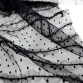 Tessuto floccaggio nero in pizzo a maglia
